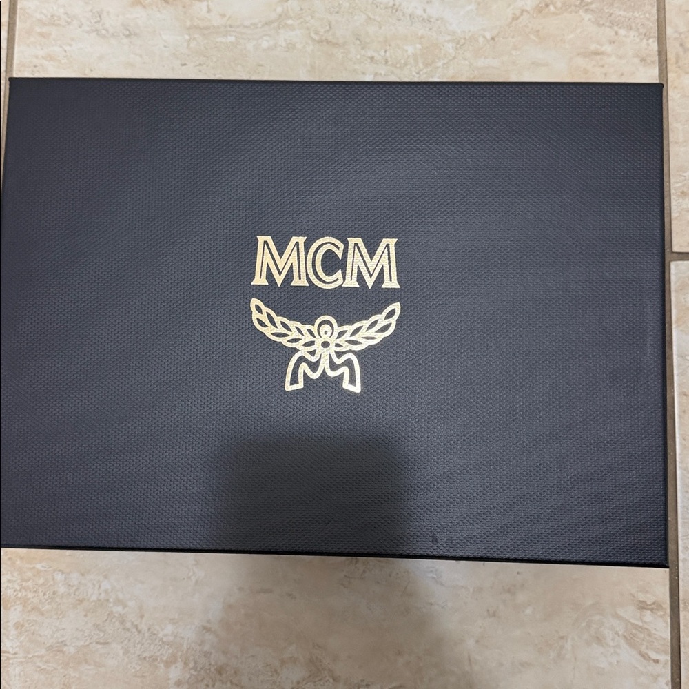 MCM Black Box with Gold Logo 
Just one time used. Excellent condition. (Used)